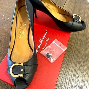 Salvatore Ferragamo Patent Leather Pumps
Peep-Toes with Bow Accents